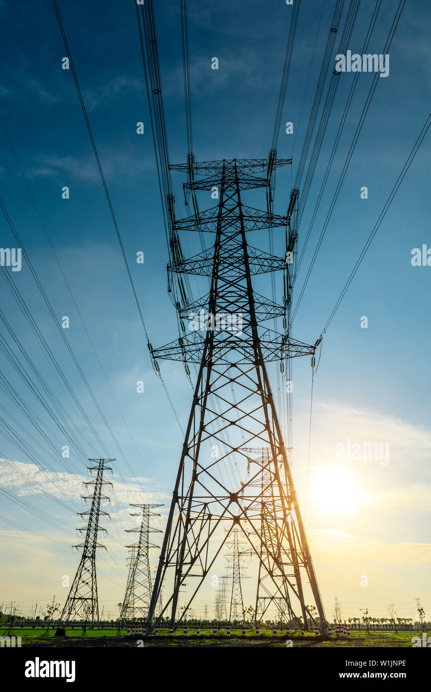 High voltage post,High voltage tower sky sunset background Stock Photo ...