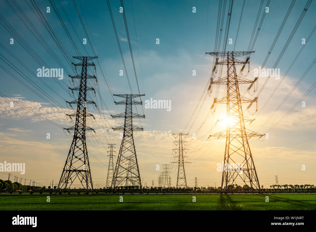 High voltage post,High voltage tower sky sunset background Stock Photo ...
