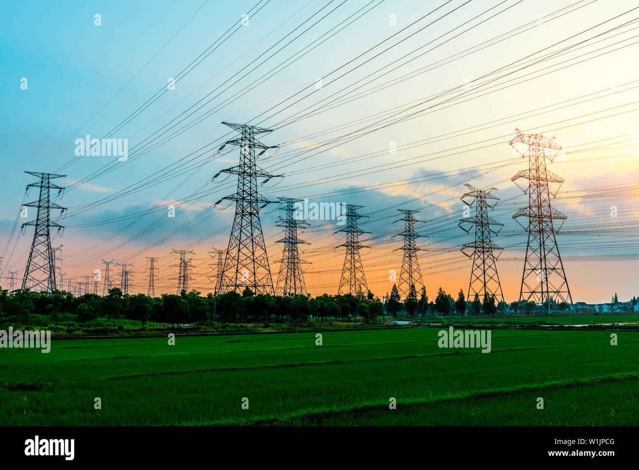 High voltage post,High voltage tower sky sunset background Stock Photo ...