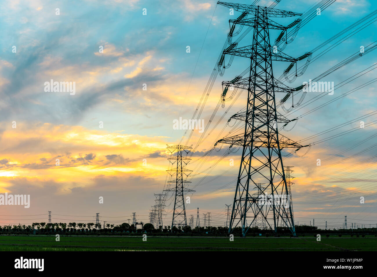 High voltage post,High voltage tower sky sunset background Stock Photo ...