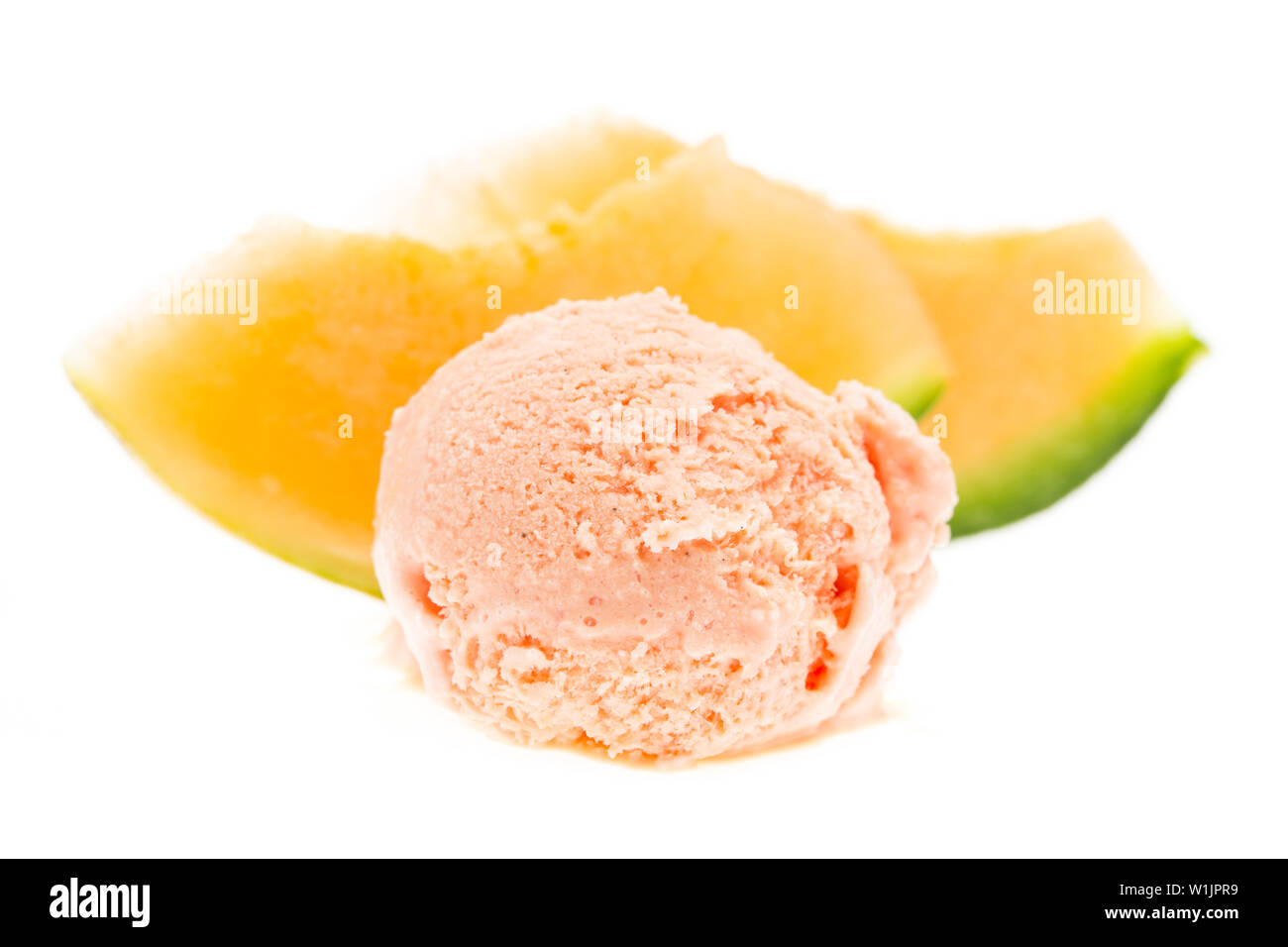 ice cream: melon ice cream ball with melon slices isolated on white background Stock Photo