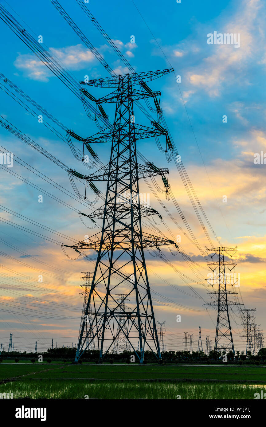 High voltage post,High voltage tower sky sunset background Stock Photo ...