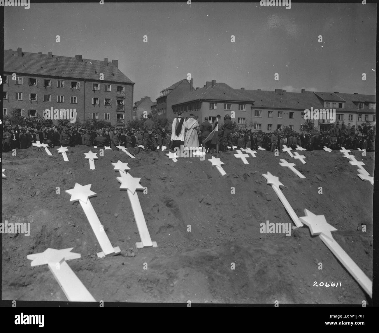 These markers are for the graves of 80 victims of the Nazis found in Ludwigslust. The entire population of Schwerin, Germany, was ordered by the Military Government to attend funeral rites conducted by U.S. Army chaplains.; General notes:  Use War and Conflict Number 1128 when ordering a reproduction or requesting information about this image. Stock Photo