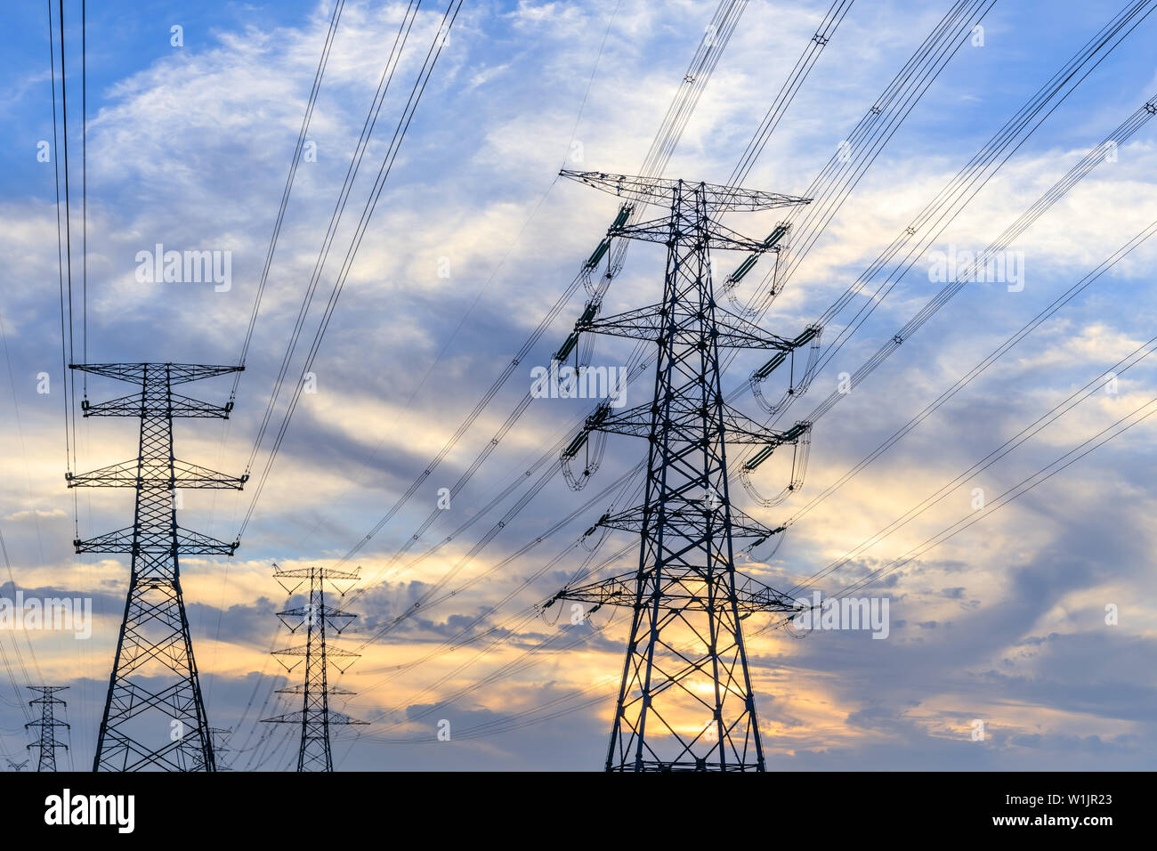 High voltage post,High voltage tower sky sunset background Stock Photo ...