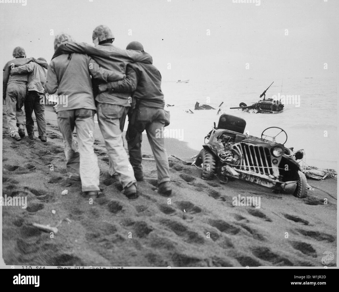 They did their part. Wounded Marines are helped to an aid station by Navy corpsmen and Marine walking wounded. Iwo Jima, circa February/March 1945.; General notes:  Use War and Conflict Number 908 when ordering a reproduction or requesting information about this image. Stock Photo