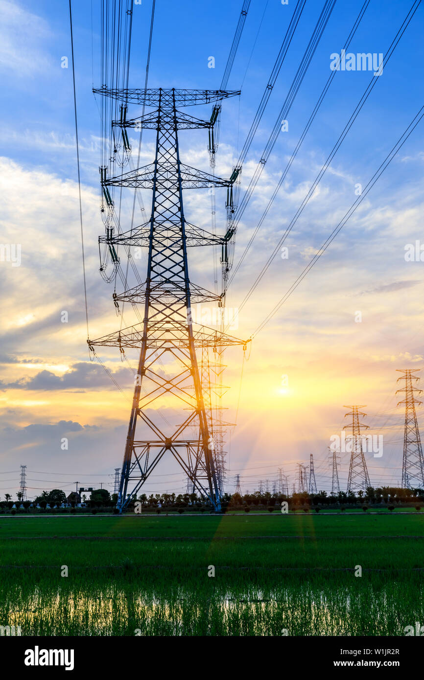 High voltage post,High voltage tower sky sunset background Stock Photo ...