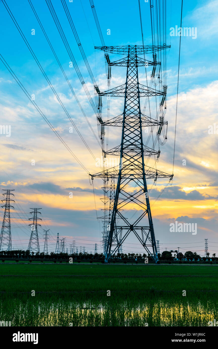 High voltage post,High voltage tower sky sunset background Stock Photo ...