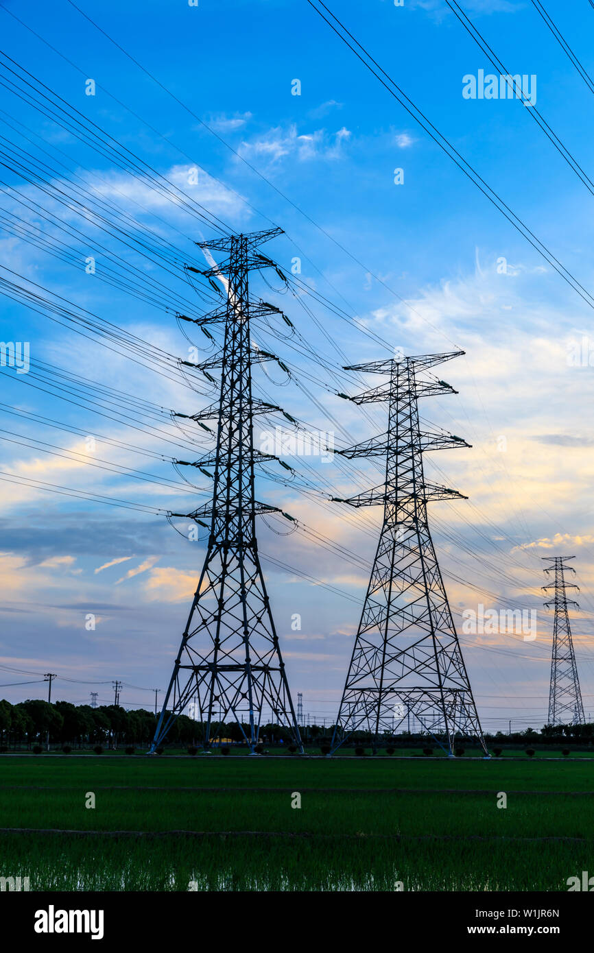 High voltage post,High voltage tower sky sunset background Stock Photo ...