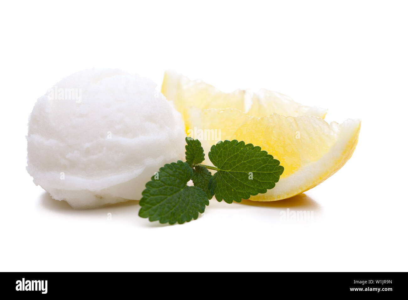 A scoop of lemon ice cream isolated on white background Stock Photo