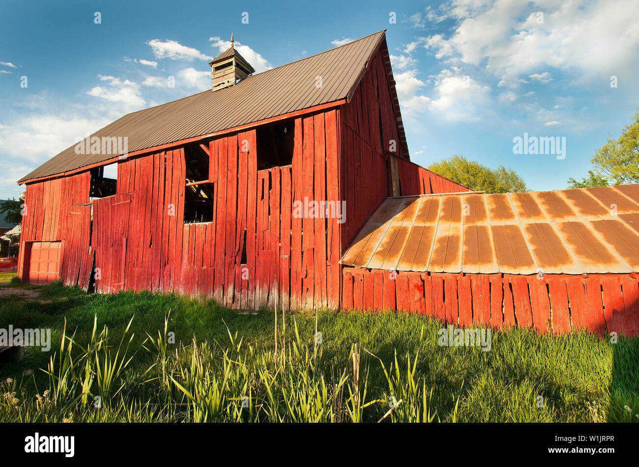 A bright red barn is bathed in sunset light in the Midway countryside in rural Wasatch County, Utah. (c) 2012 Tom Kelly Stock Photo