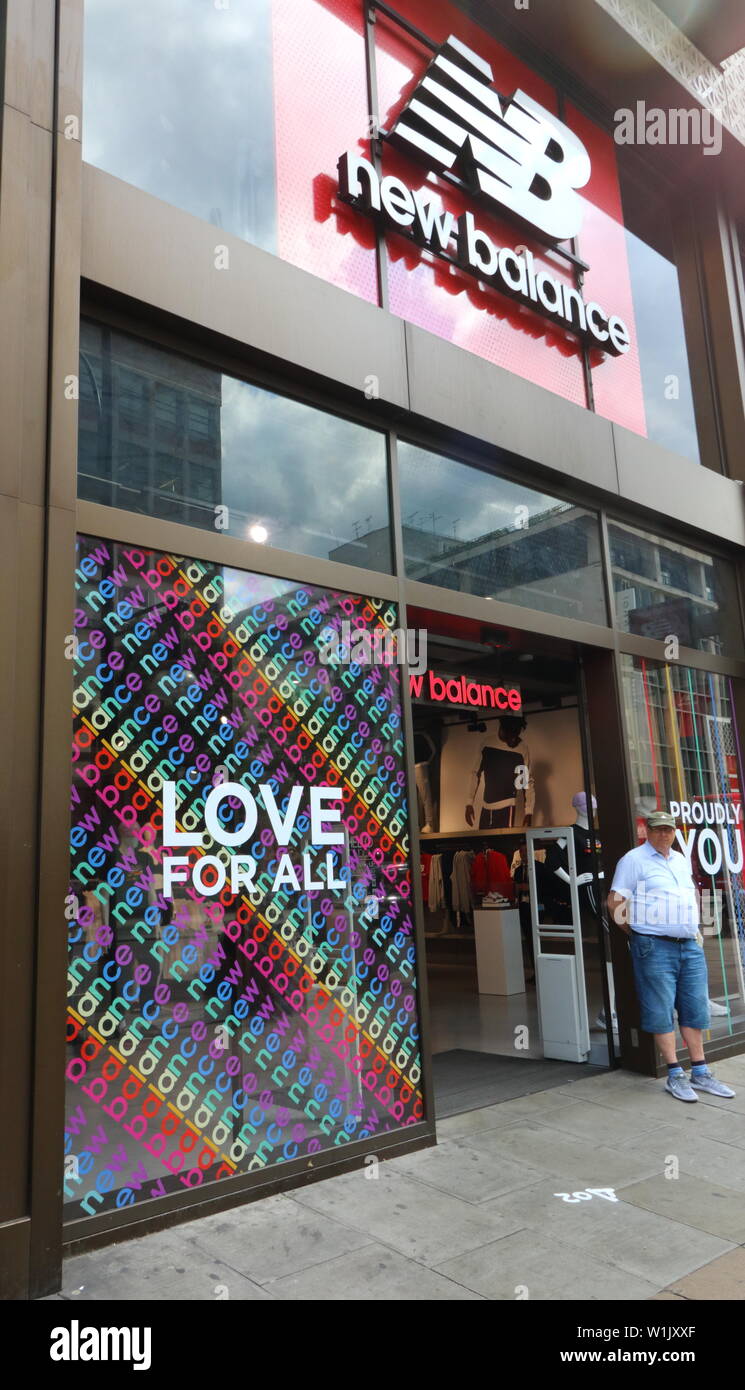 London, UK. 2nd July, 2019. New Balance store window is being written Love  For All artwork.Many retail stores in the capital's shopping heartland of  the West End are currently decorated in rainbow
