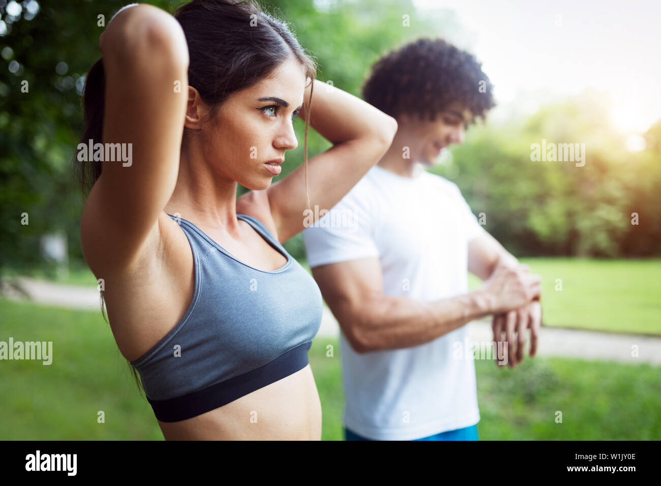 Beautiful couple jogging in nature living healthy Stock Photo - Alamy
