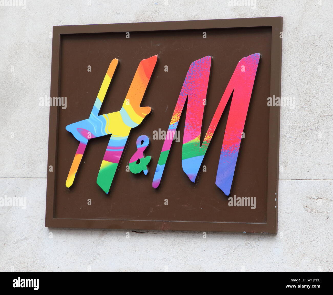 London, UK. 2nd July, 2019. H&M store logo is being decorated with Rainbow  colours.Many retail stores in the capital's shopping heartland of the West  End are currently decorated in rainbow colours, supporting