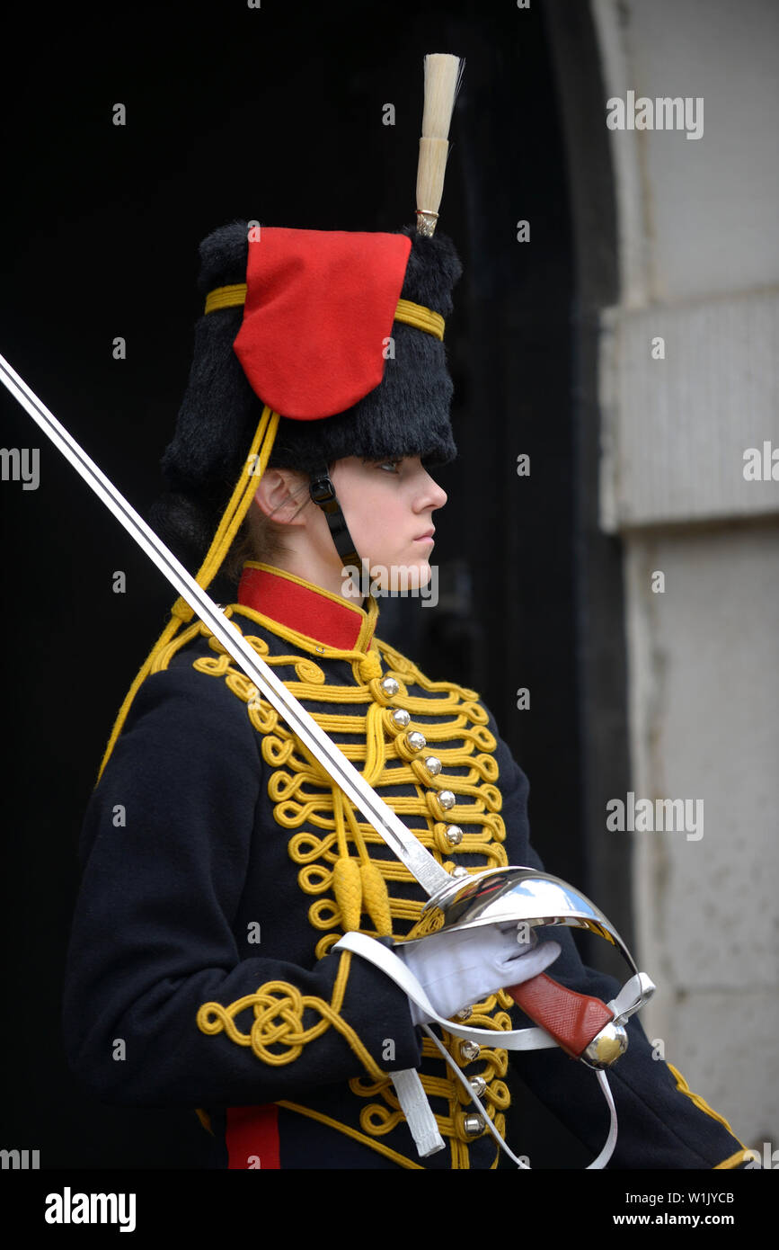 London, England, UK. Female member of the King's Troop, Royal Horse Artillery, on duty outside Horse Guards in Whitehall. Stock Photo