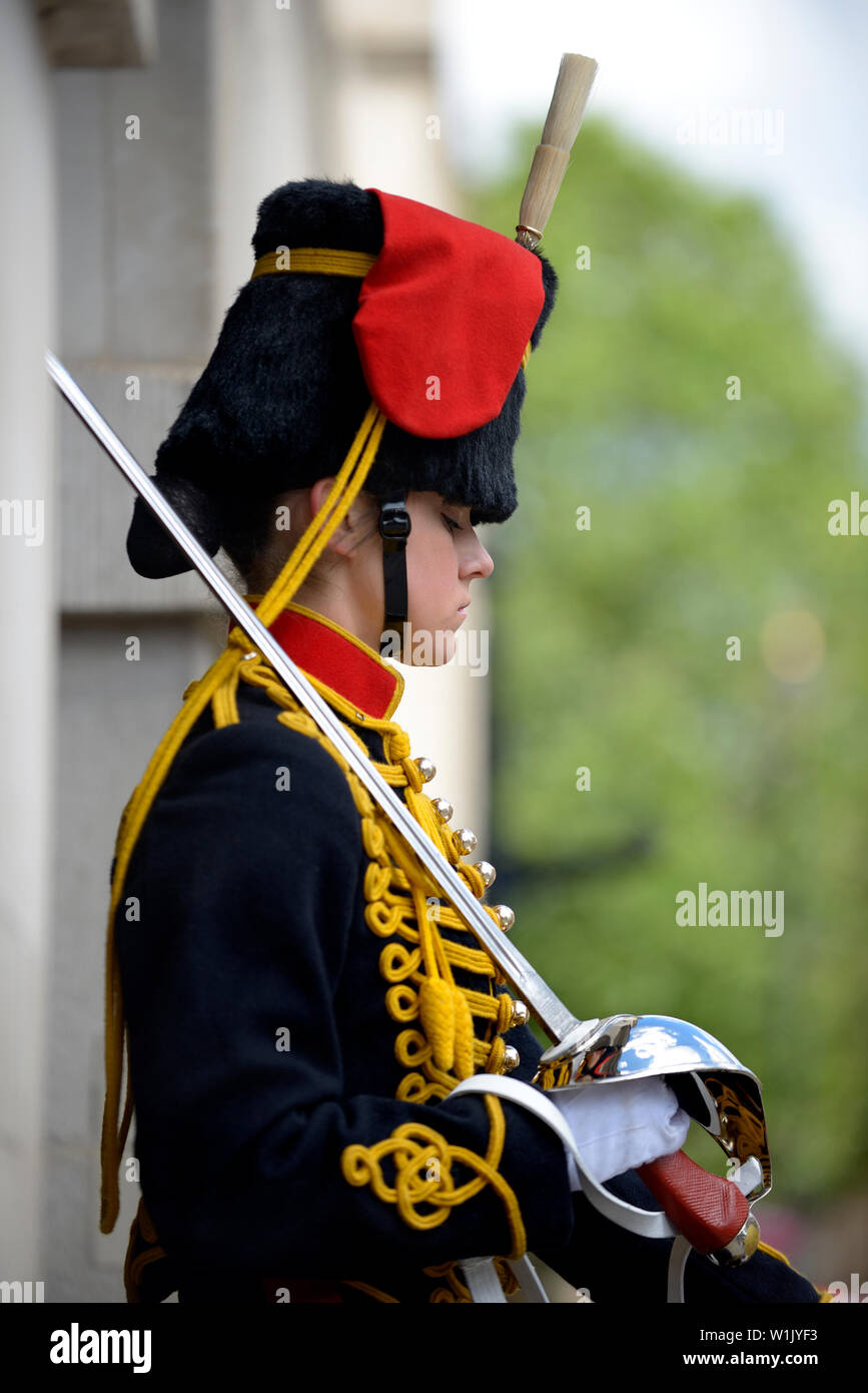 London, England, UK. Female member of the King's Troop, Royal Horse Artillery, on duty outside Horse Guards in Whitehall. Stock Photo