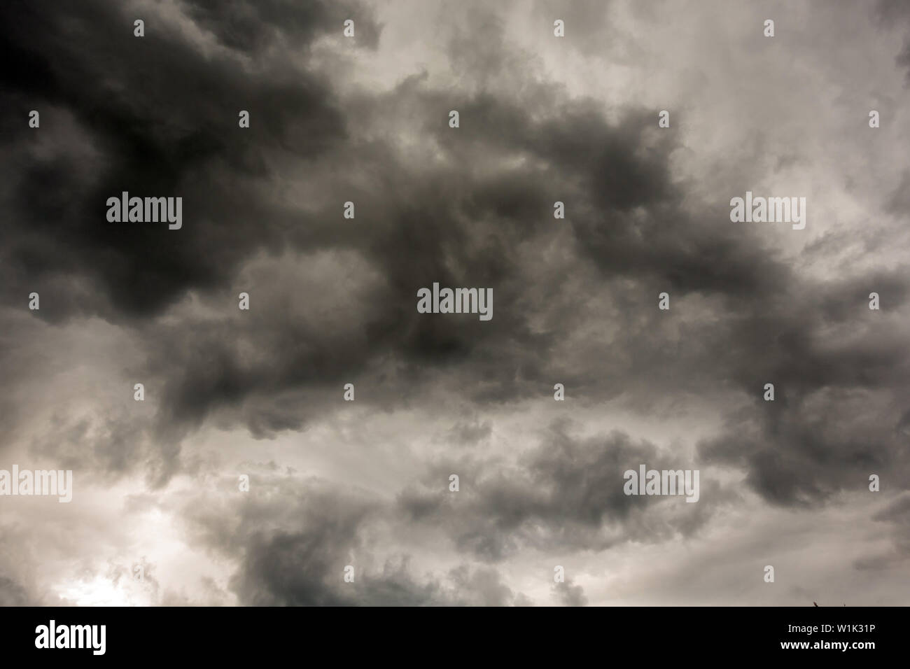 Dark and Dramatic Storm Clouds Area Background Stock Photo