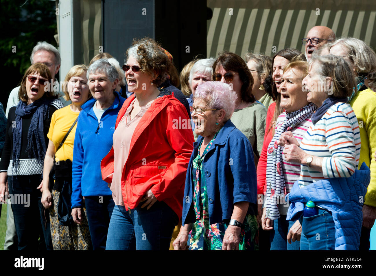 A community choir singing at the Leamington Peace Festival, Leamington Spa, UK Stock Photo