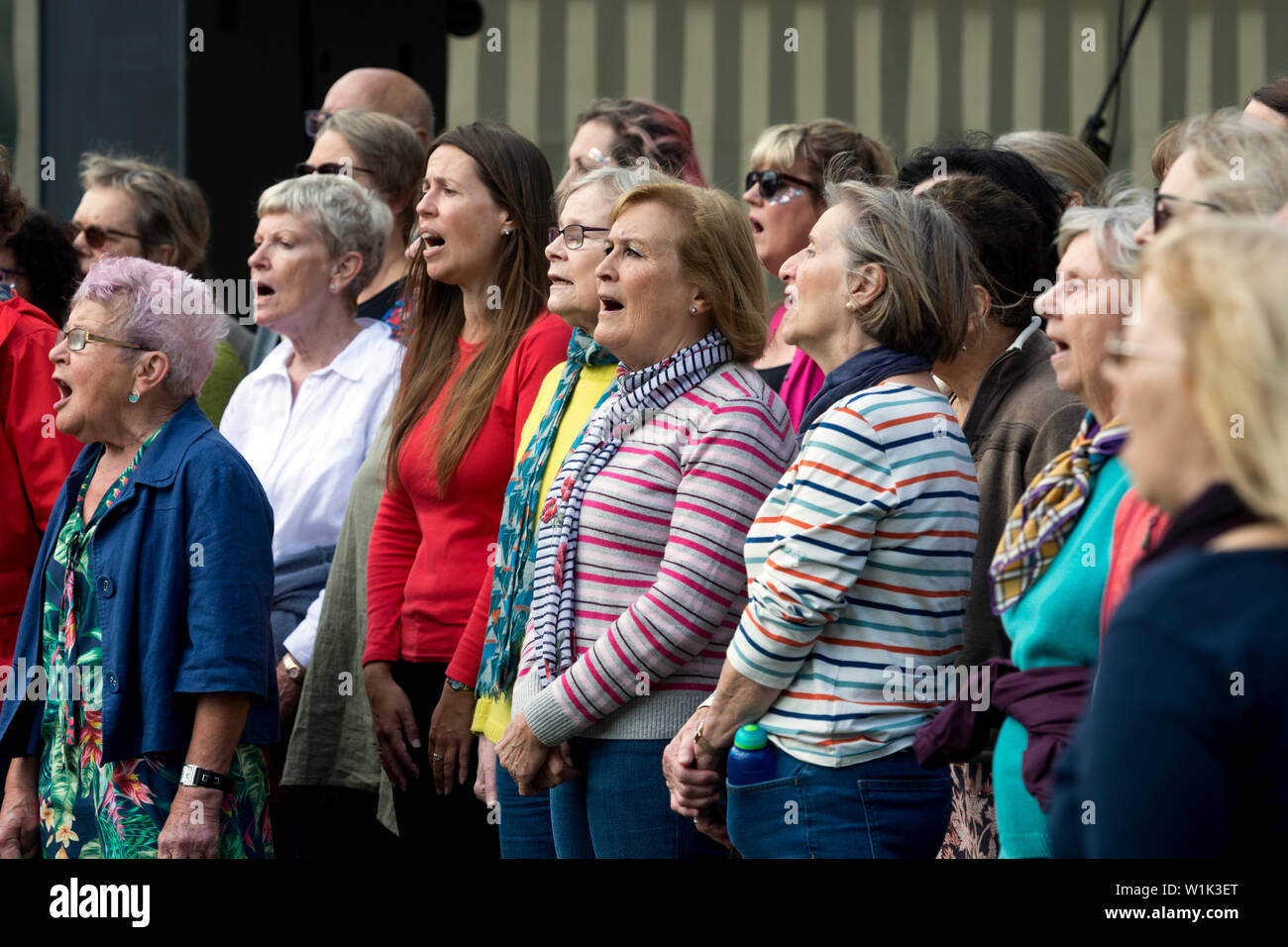 A community choir singing at the Leamington Peace Festival, Leamington Spa, UK Stock Photo
