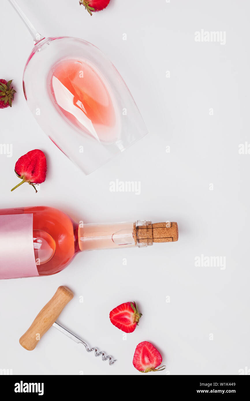 Creative composition with rose wine and strawberries, top view Stock