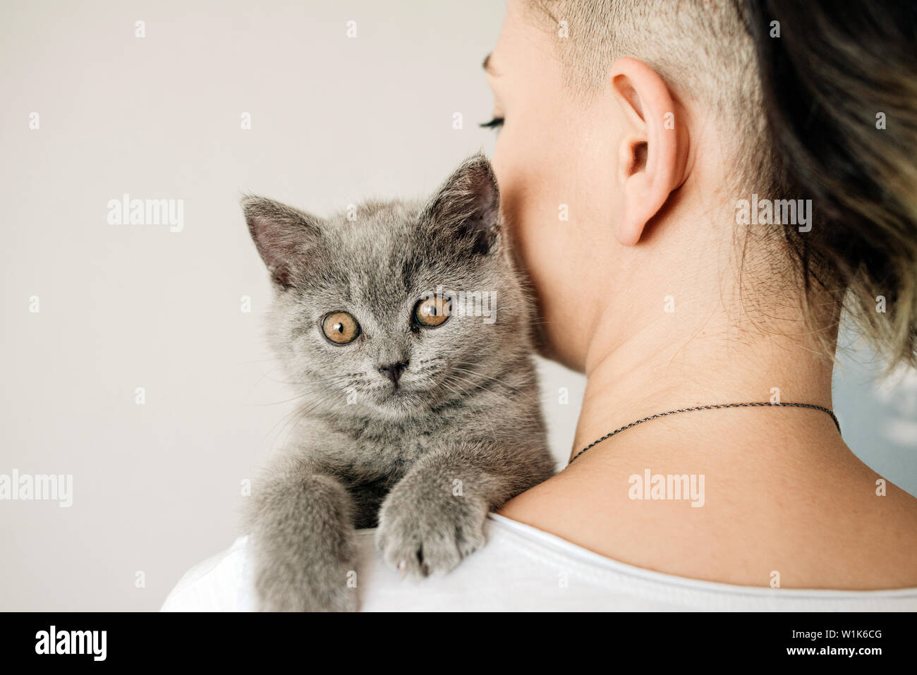 Beautiful Young Woman With Cute Cat Resting At Home The British