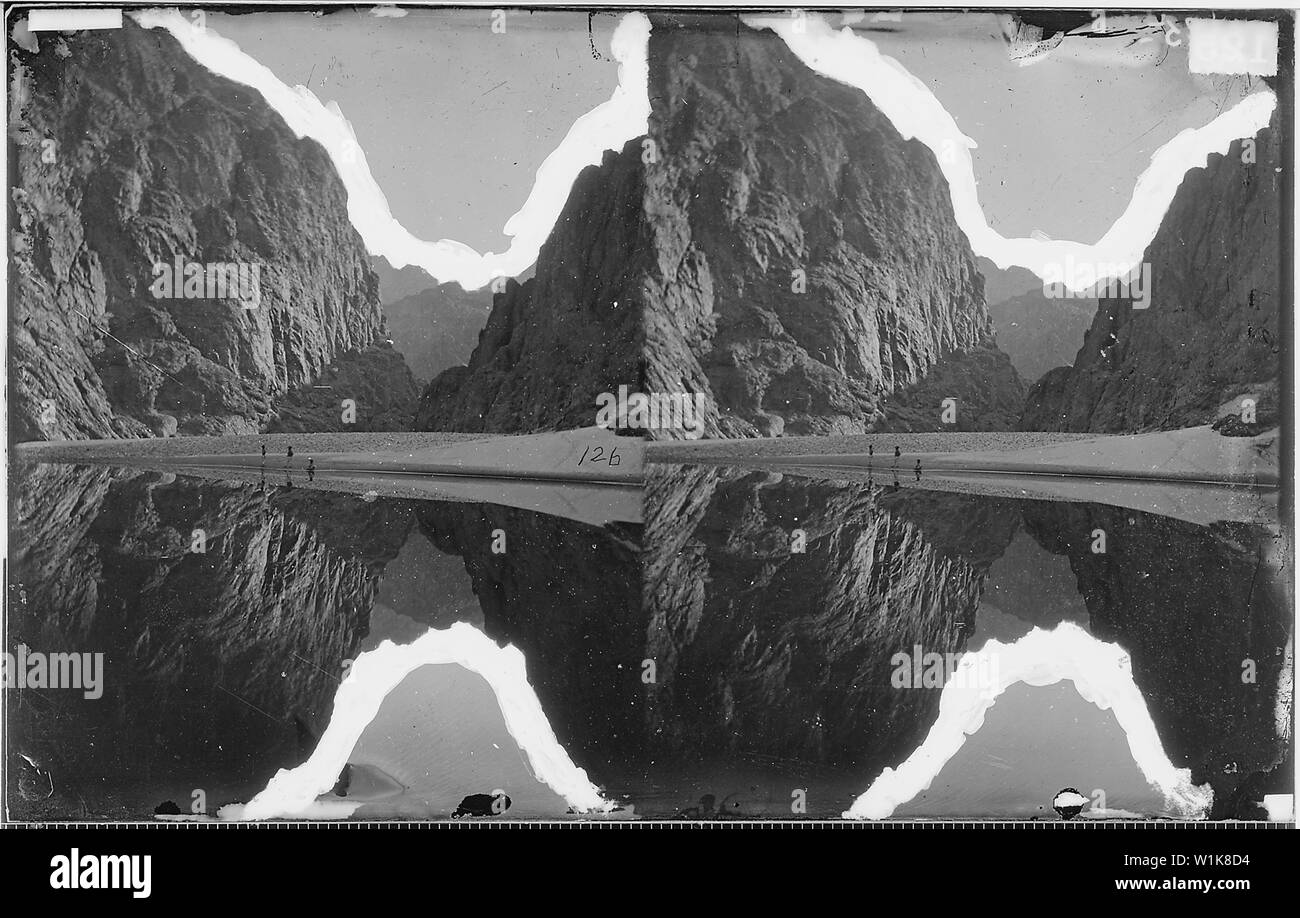 VIEW DOWN BLACK CANYON FROM MIRROR BAR, THE WALLS REPEATED BY REFLECTION, COLORADO RIVER Stock Photo