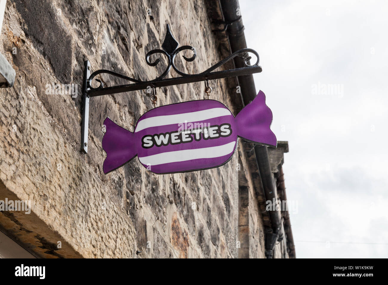 A Sweeties sign outside a shop in Rothbury,England,UK Stock Photo