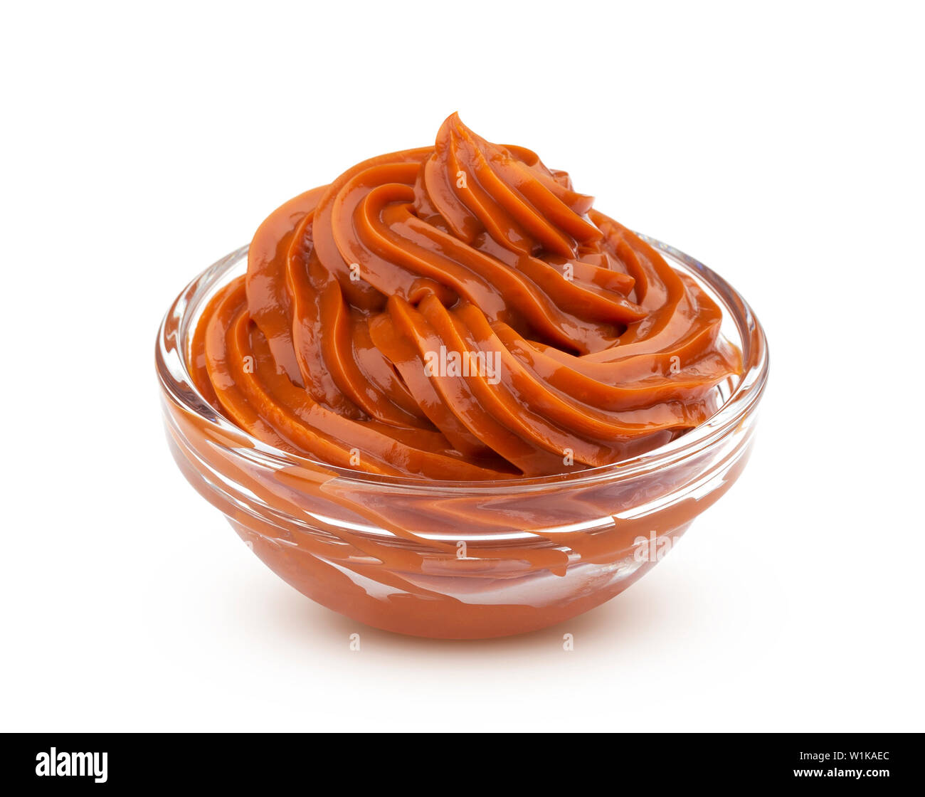 Boiled condensed milk, caramel cream isolated on white background Stock