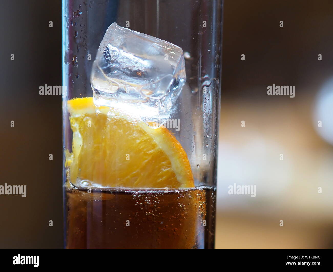 June 2019 -An Icy Cold Glass Of Sparkling Soft Drink With A Slice Of Orange Stock Photo