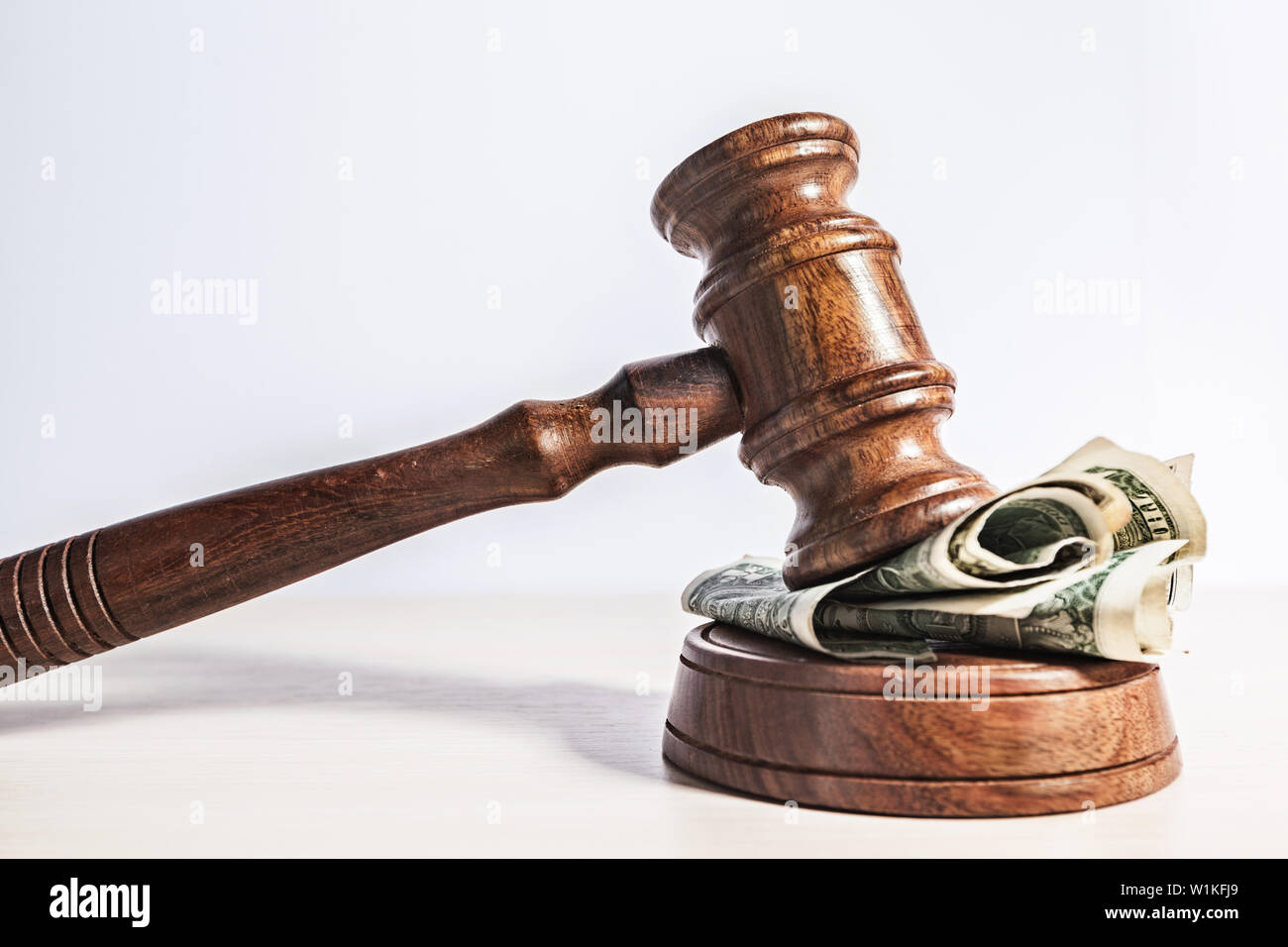 judge gavel and money on brown wooden table concept Stock Photo