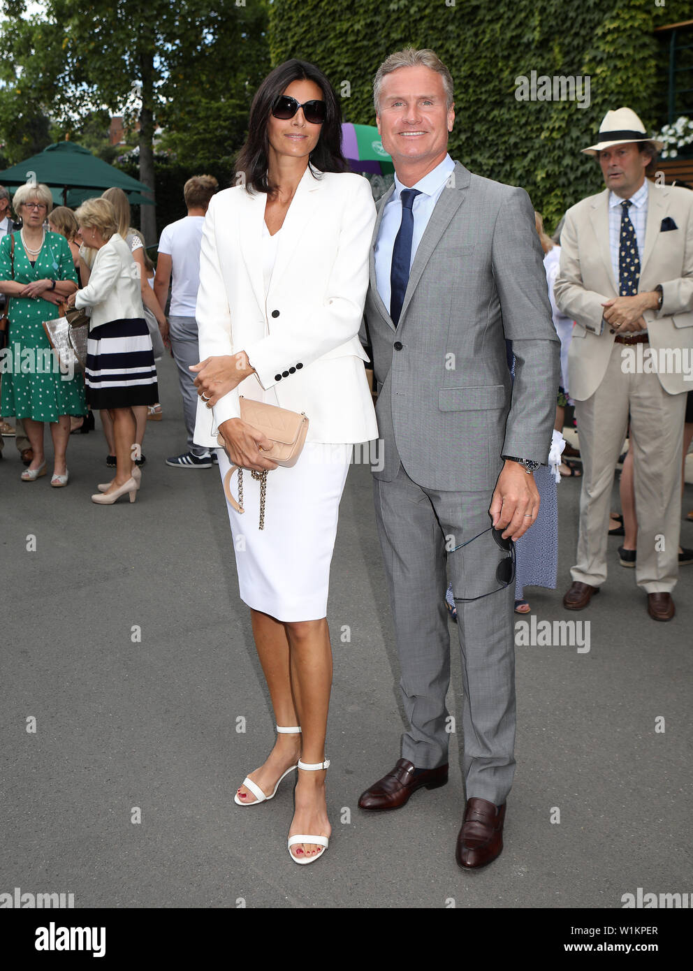 Karen Minier and David Coulthard on day three of the Wimbledon Championships at the All England Lawn tennis and Croquet Club, London. Stock Photo