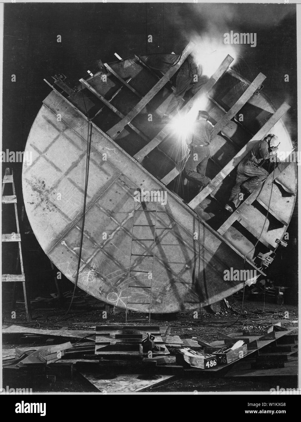 Welders work on hull of new submarine at Electric Boat Company in