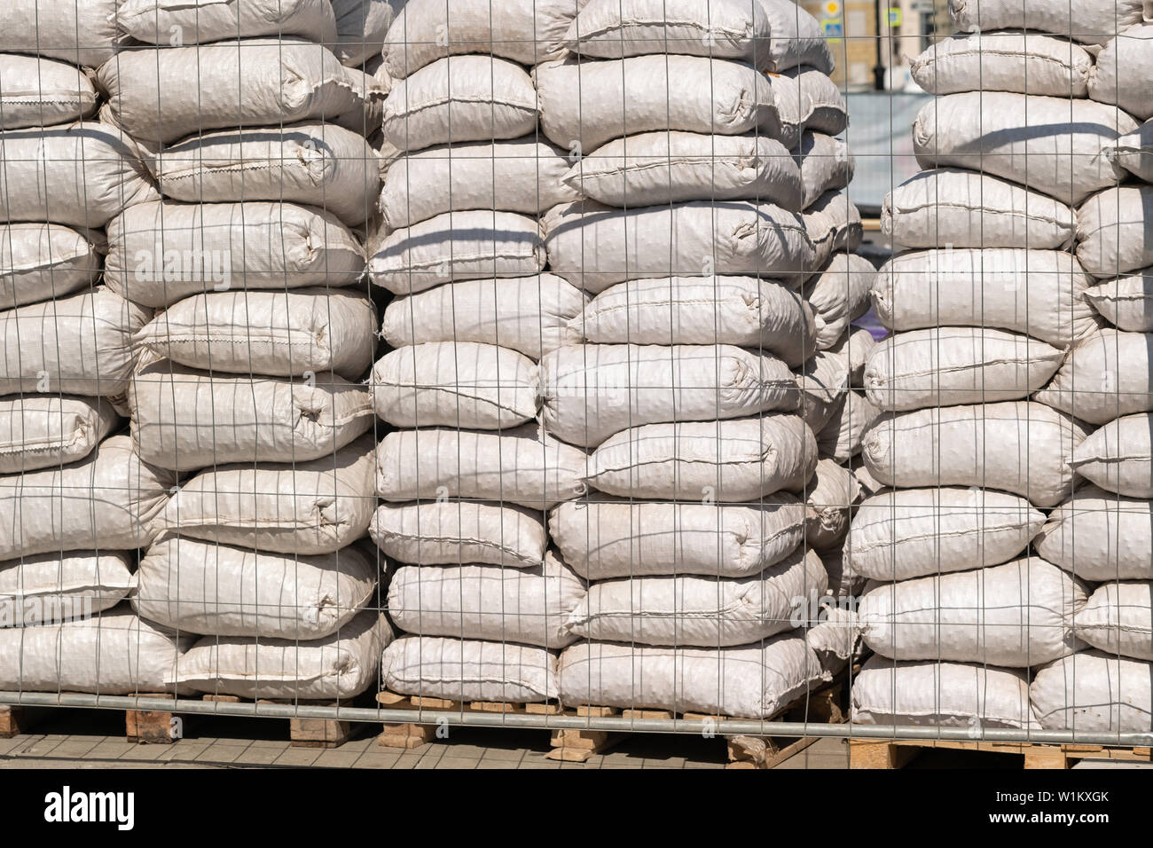 Description White polyethylene bags with factory products in warehouse