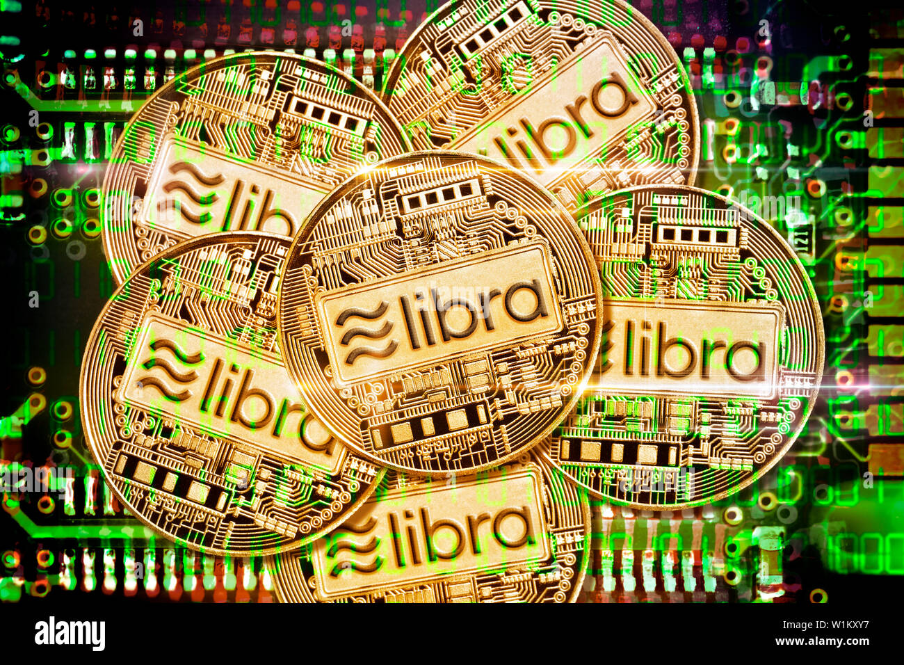 Libra cryptocurrency coins on computer circuit board Stock Photo