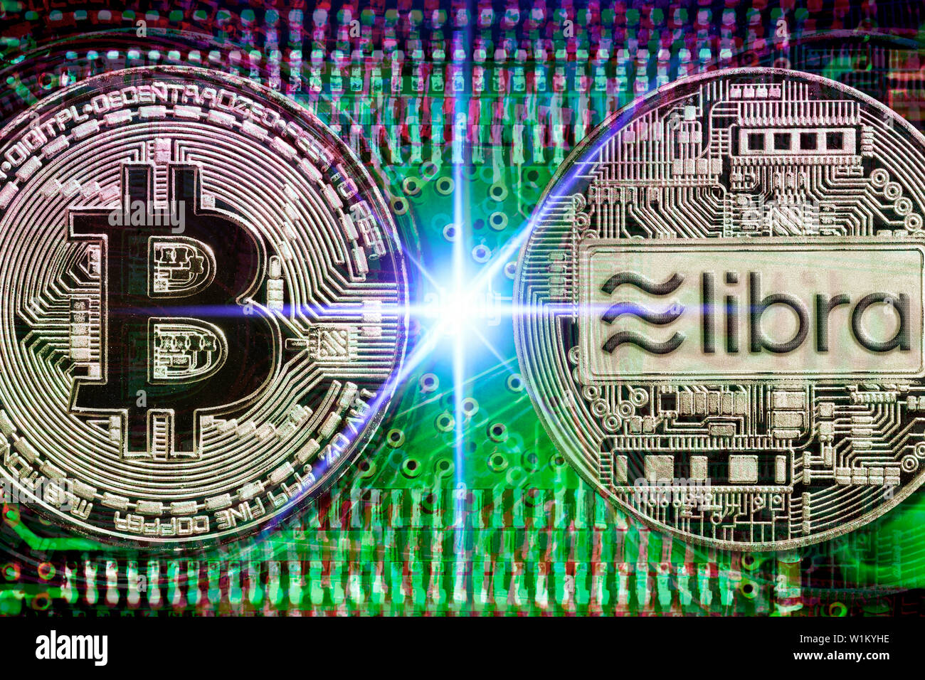 Bitcoin and libra cryptocurrency coins on computer circuit board Stock Photo