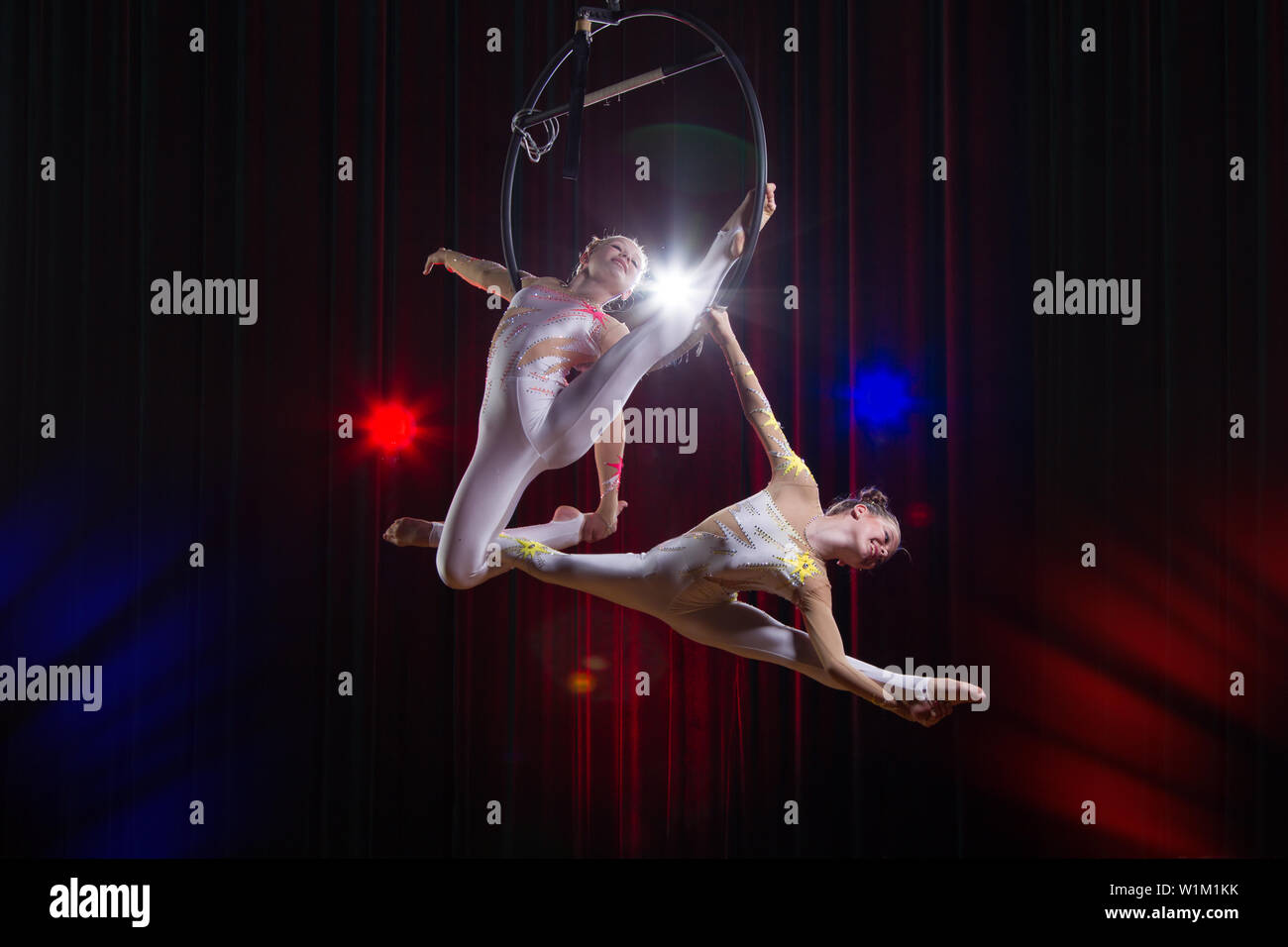Circus actress acrobat performance. Two girls perform acrobatic ...