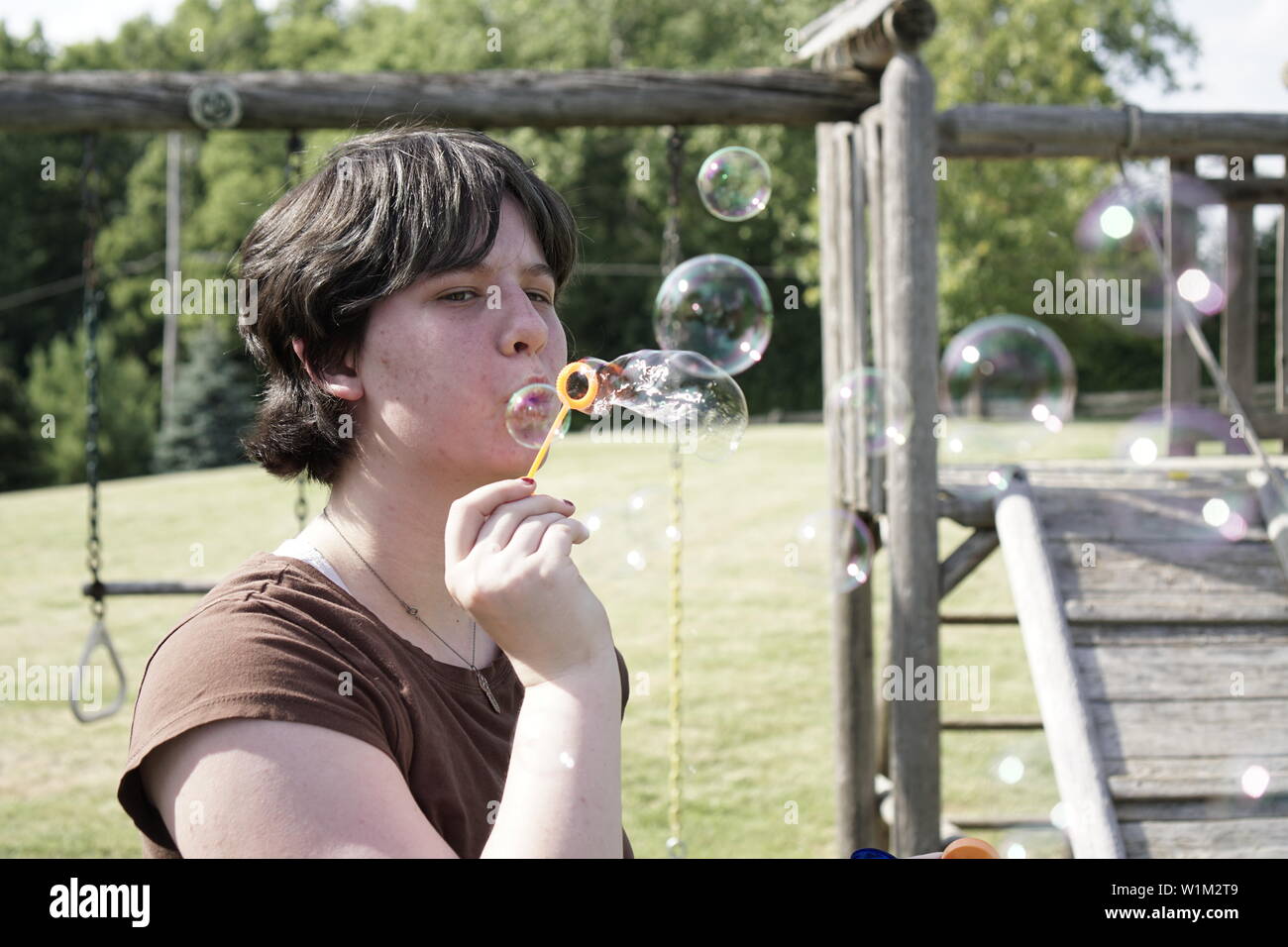 Teen blowing bubbles hi-res stock photography and images - Alamy