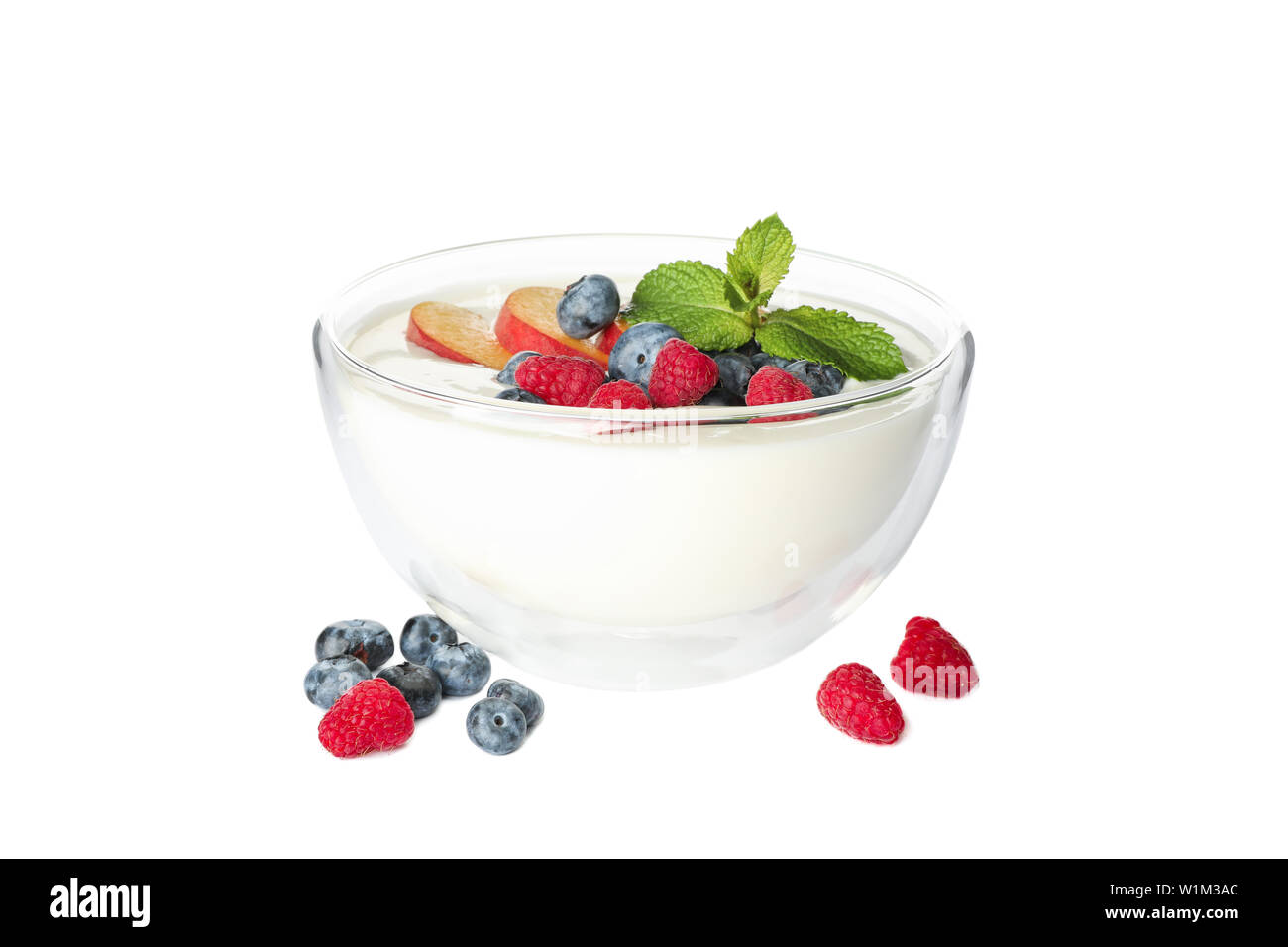 Bowl with sour cream yogurt and fruits isolated on white background Stock Photo