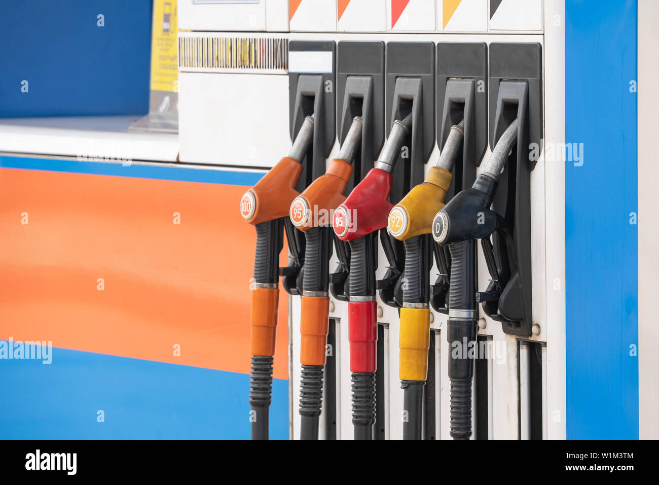 description: Close up nozzle fuel at gas station Stock Photo