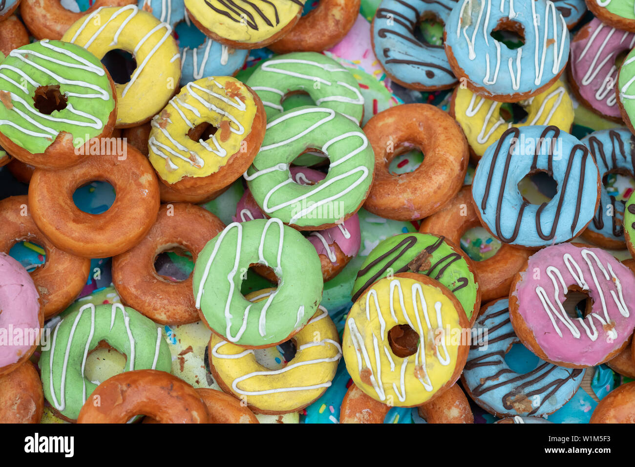 description: Glazed donuts on color background Stock Photo