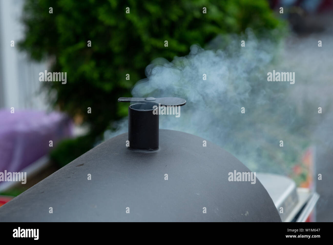 description Puffy smoke from charcoal chimney starter Stock Photo Alamy