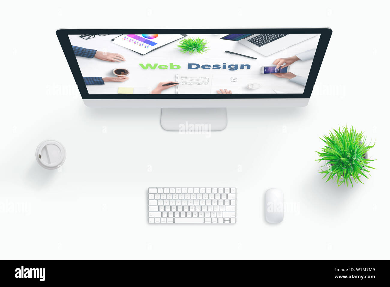 Web design studio concept. Flat lay scene with computer display and web design text. Stock Photo