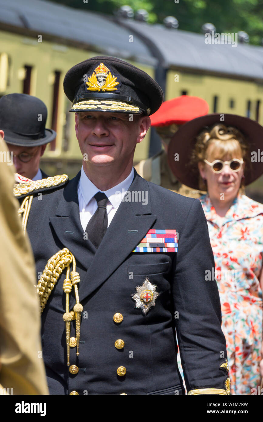 Kidderminster, UK. 29th June, 2019. Severn Valley Railways 'Step back to the 1940's' gets off to a fabulous start this weekend with costumed re-enactors playing their part in providing an authentic recreation of wartime Britain. A convincing King George VI lookalike, heading the VIP party, ensures that visitors are successfully transported back in time as they watch his majesty being escorted around the region. Credit: Lee Hudson Stock Photo