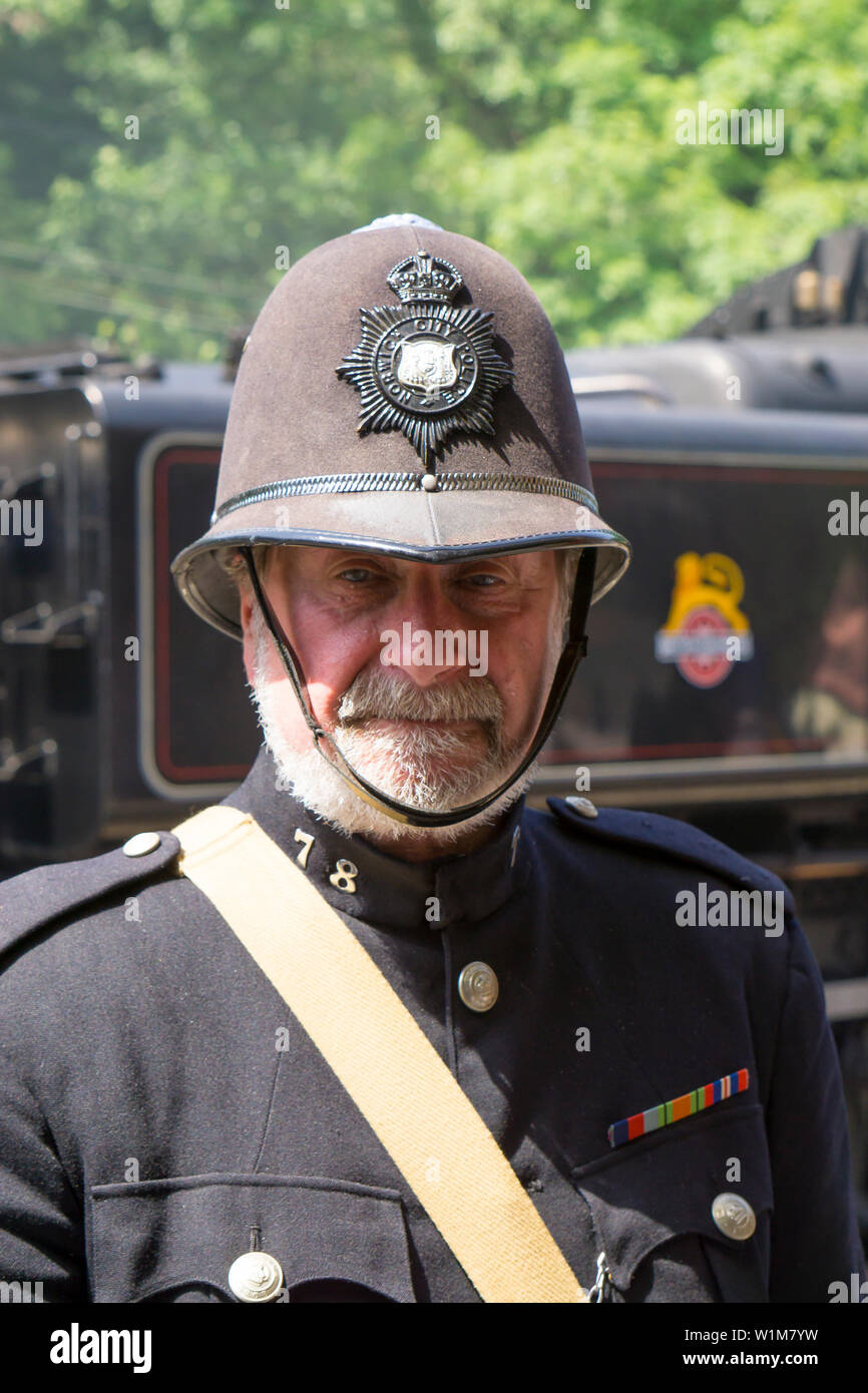 Kidderminster, UK. 29th June, 2019. Severn Valley Railways 'Step back to the 1940's' gets off to a fabulous start this weekend with re-enactors providing an authentic recreation of WW2 wartime Britain. A vintage policeman sweltering on duty in full police uniform ensures a British Bobby is always present. Credit: Lee Hudson Stock Photo