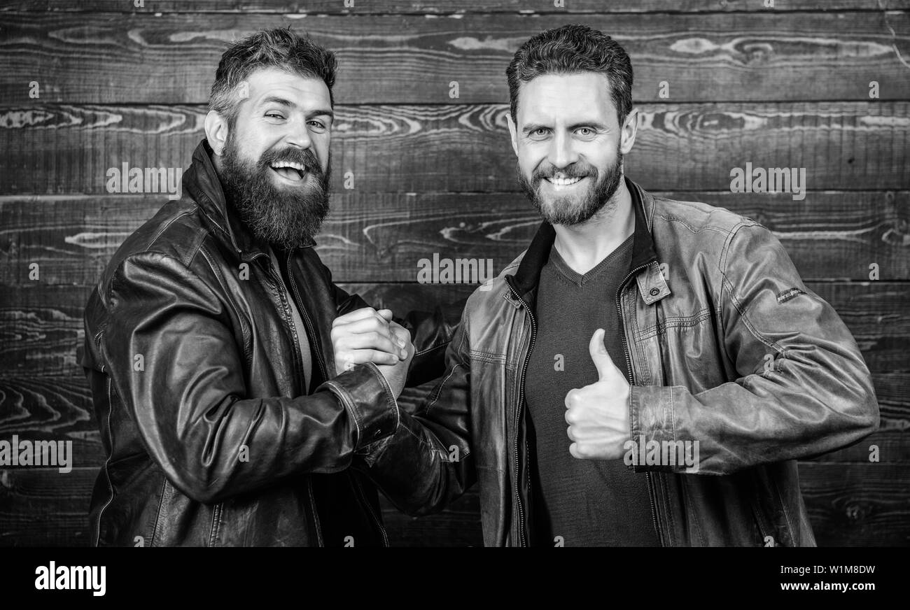 Handshake symbol of successful deal. Have agreed. Brutal bearded men