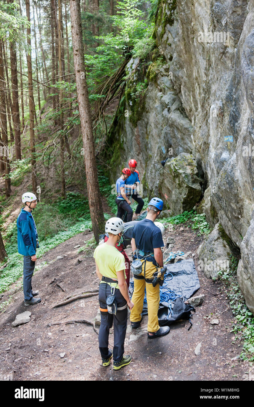 Group of climbers preparing for rock climbing, Sautens, Otztal, Tyrol, Austria Stock Photo