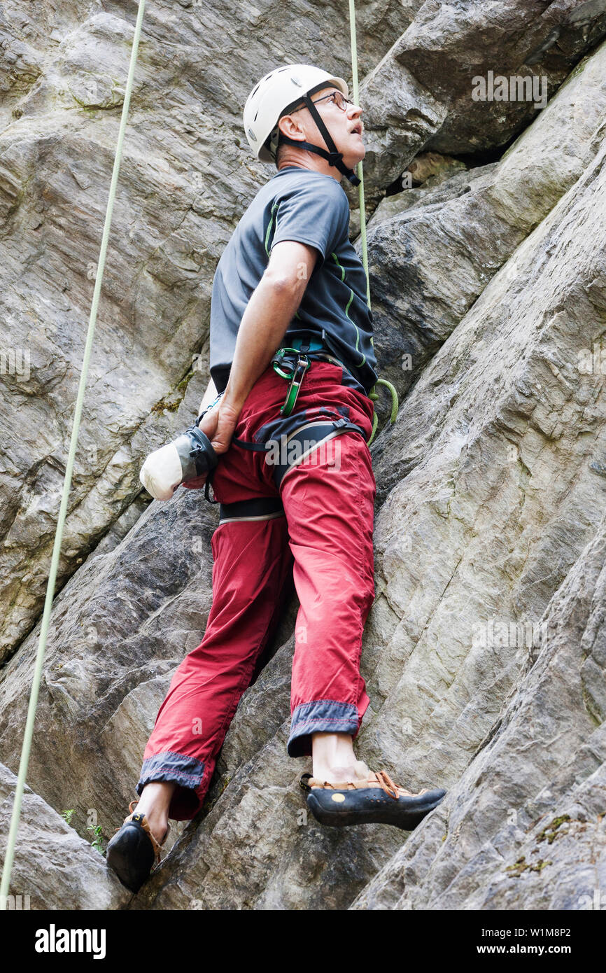 Male climber scaling rock face, Sautens, Otztal, Tyrol, Austria Stock Photo