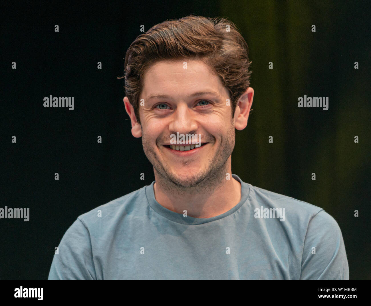 STUTTGART, GERMANY - JUN 29th 2019: Iwan Rheon (*1985, Welsh actor, singer and musician) talks about his experiences in the movie industry at Comic Con Germany Stuttgart, a two day fan convention Stock Photo