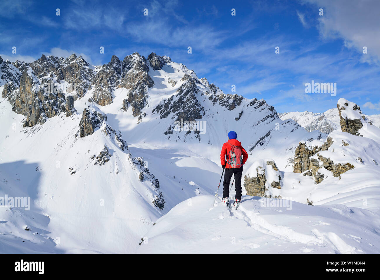 Woman back-country skiing looking towards valley Vallonasso di Sautron,  Monte Soubeyran, Valle Maira, Cottian Alps, Piedmont, Italy Stock Photo -  Alamy