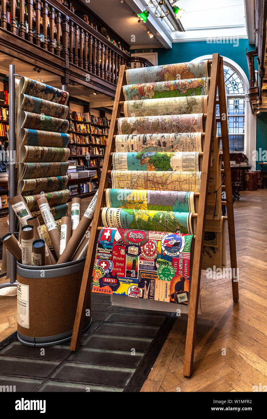 Vertical display stand with maps and wrapping papers, Daunt Books, Marylebone High Street, London W1U, England, UK. Stock Photo