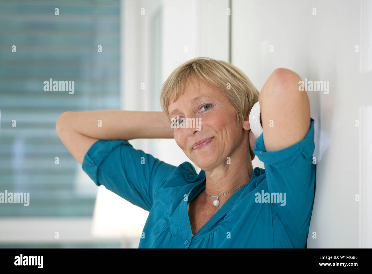 Mature woman smiling at camera, Styria, Austria Stock Photo